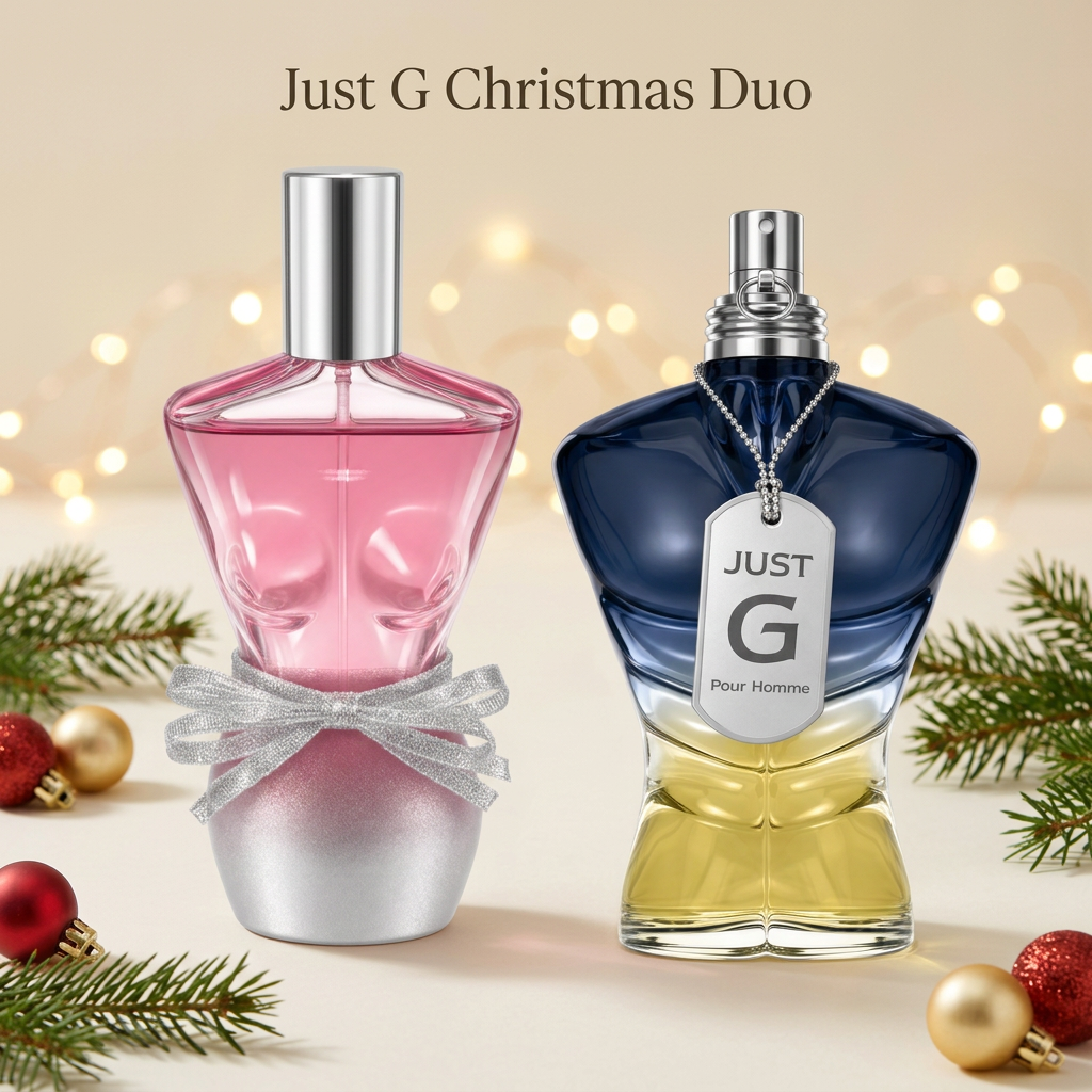Just G women’s and Just G Pour Homme fragrance bottles with Christmas greenery, red and gold baubles, and warm lights.